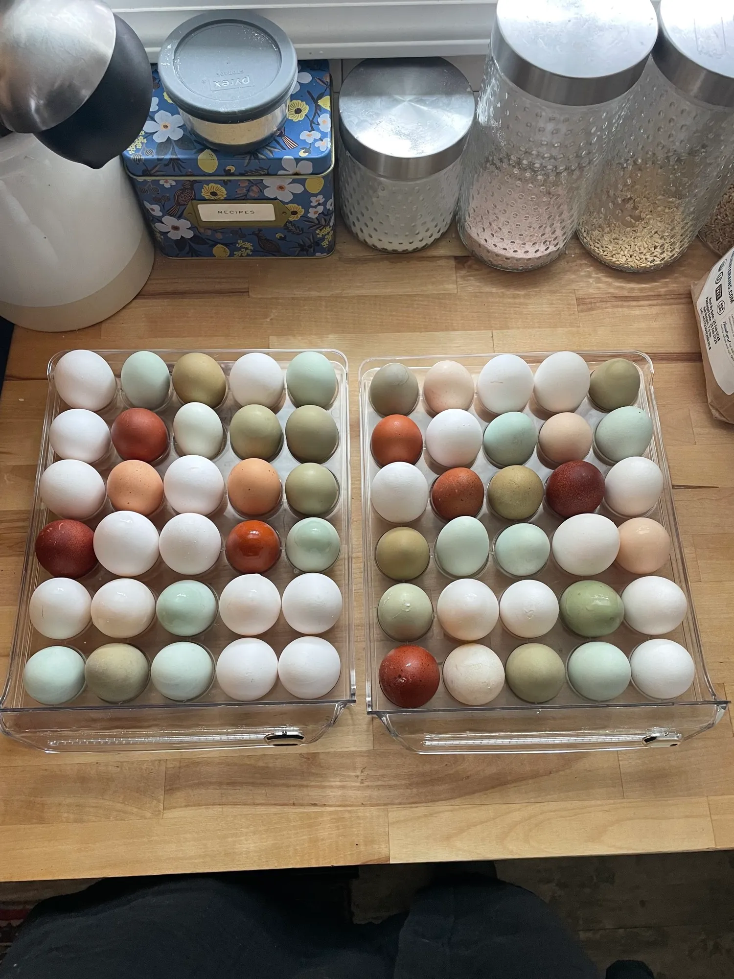 Colorful farm fresh eggs in tones of sage, terracotta, and cream