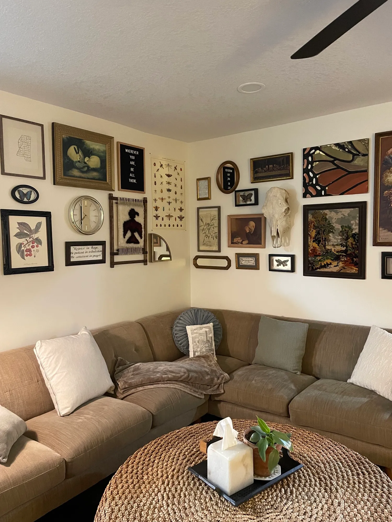 Gallery wall arrangement with vintage art and frames