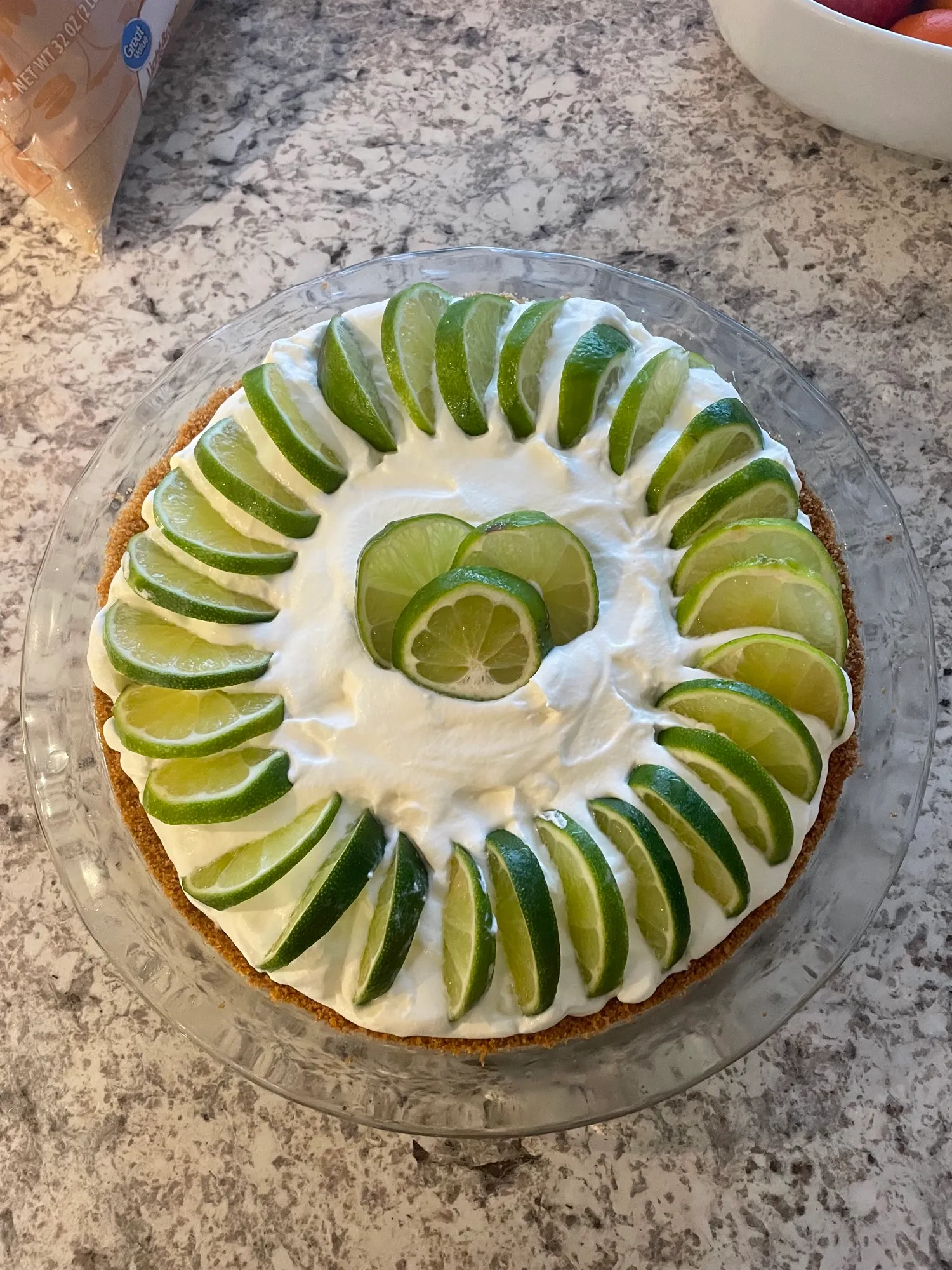 Key lime pie with cream and lime slices