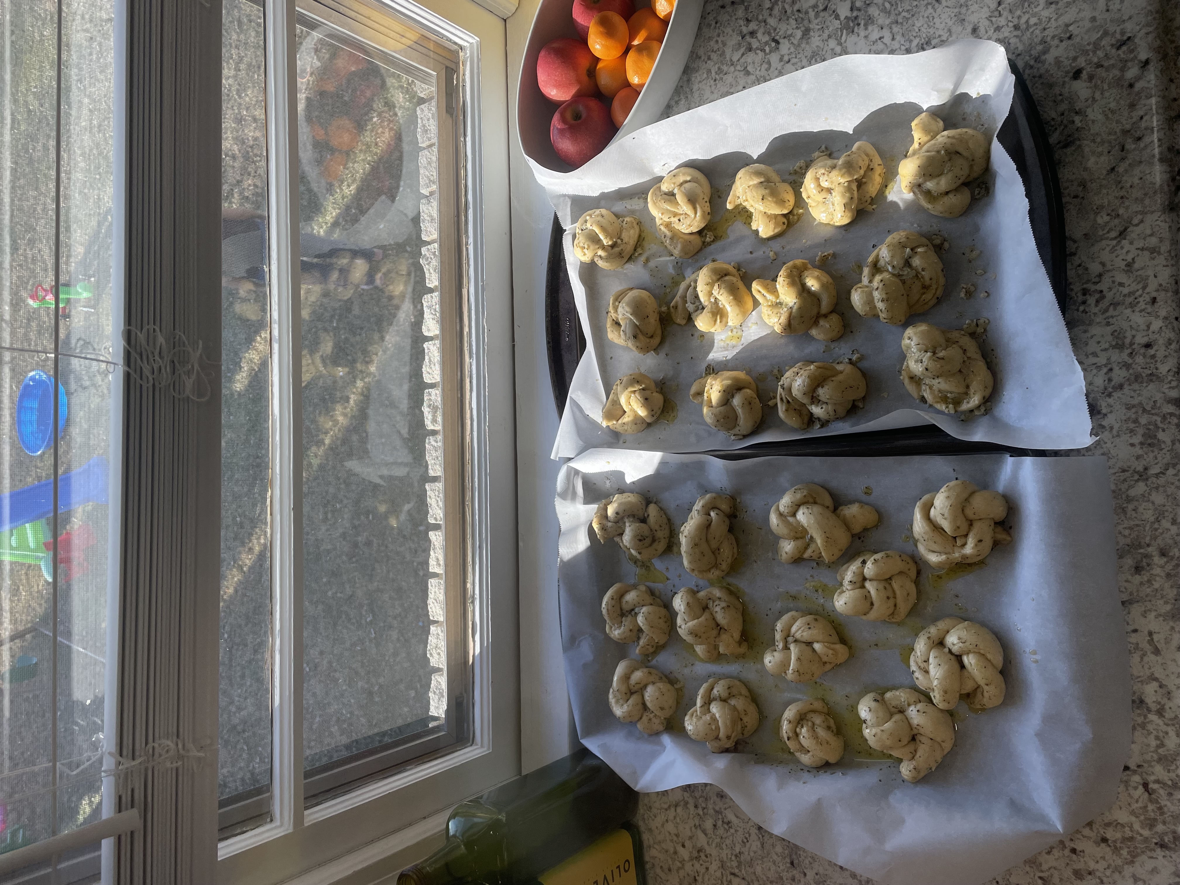 Garlic knots on a baking sheet