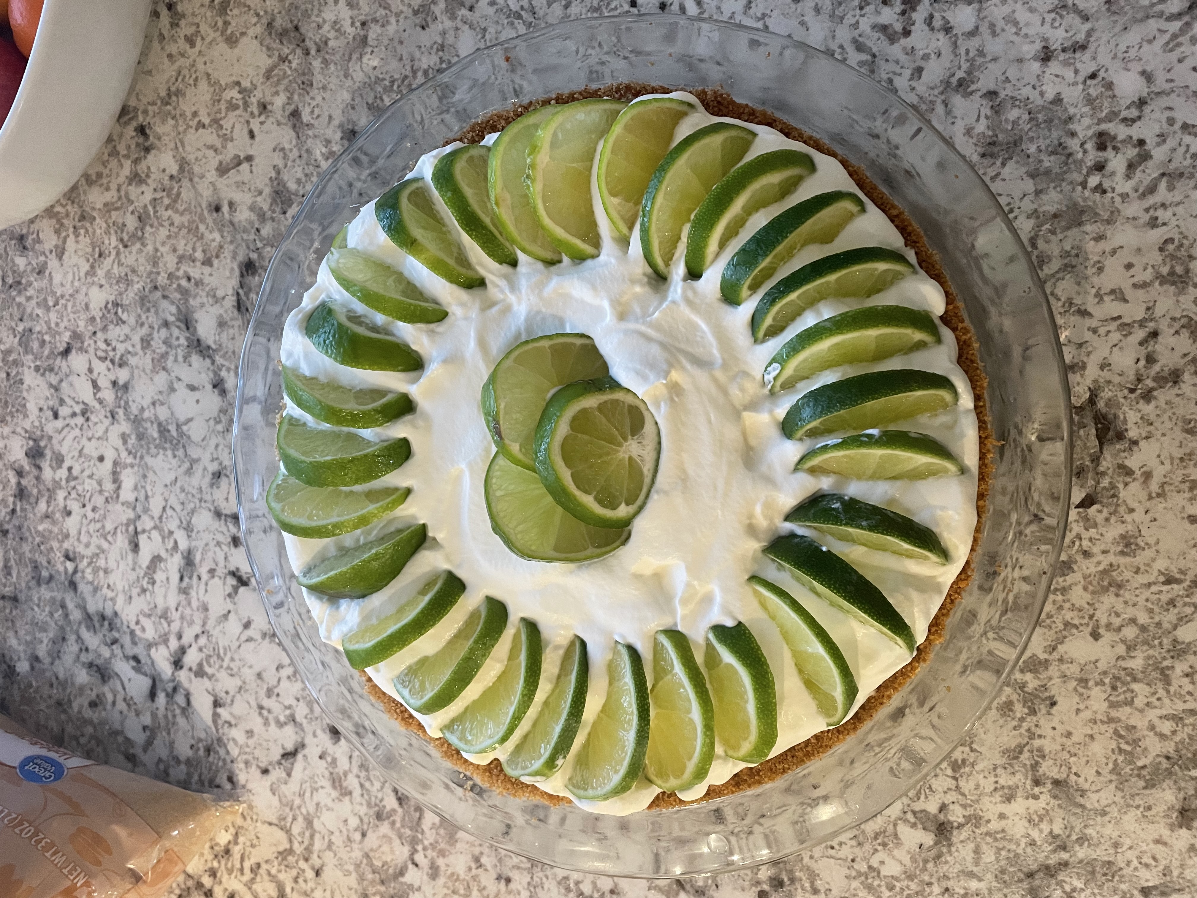 Key lime pie with cream and lime slices