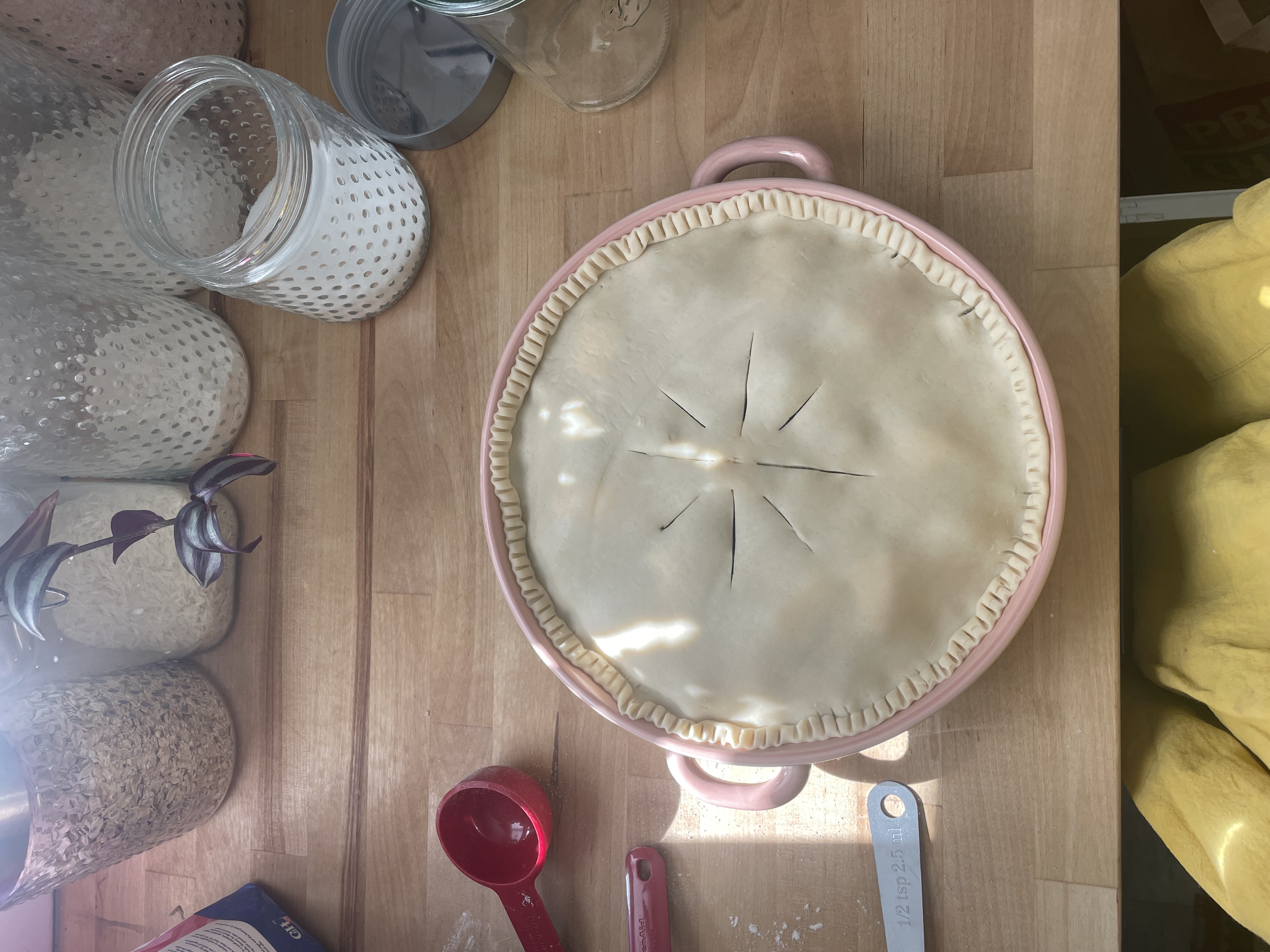 Unbaked pie in a pie dish with crimped crust
