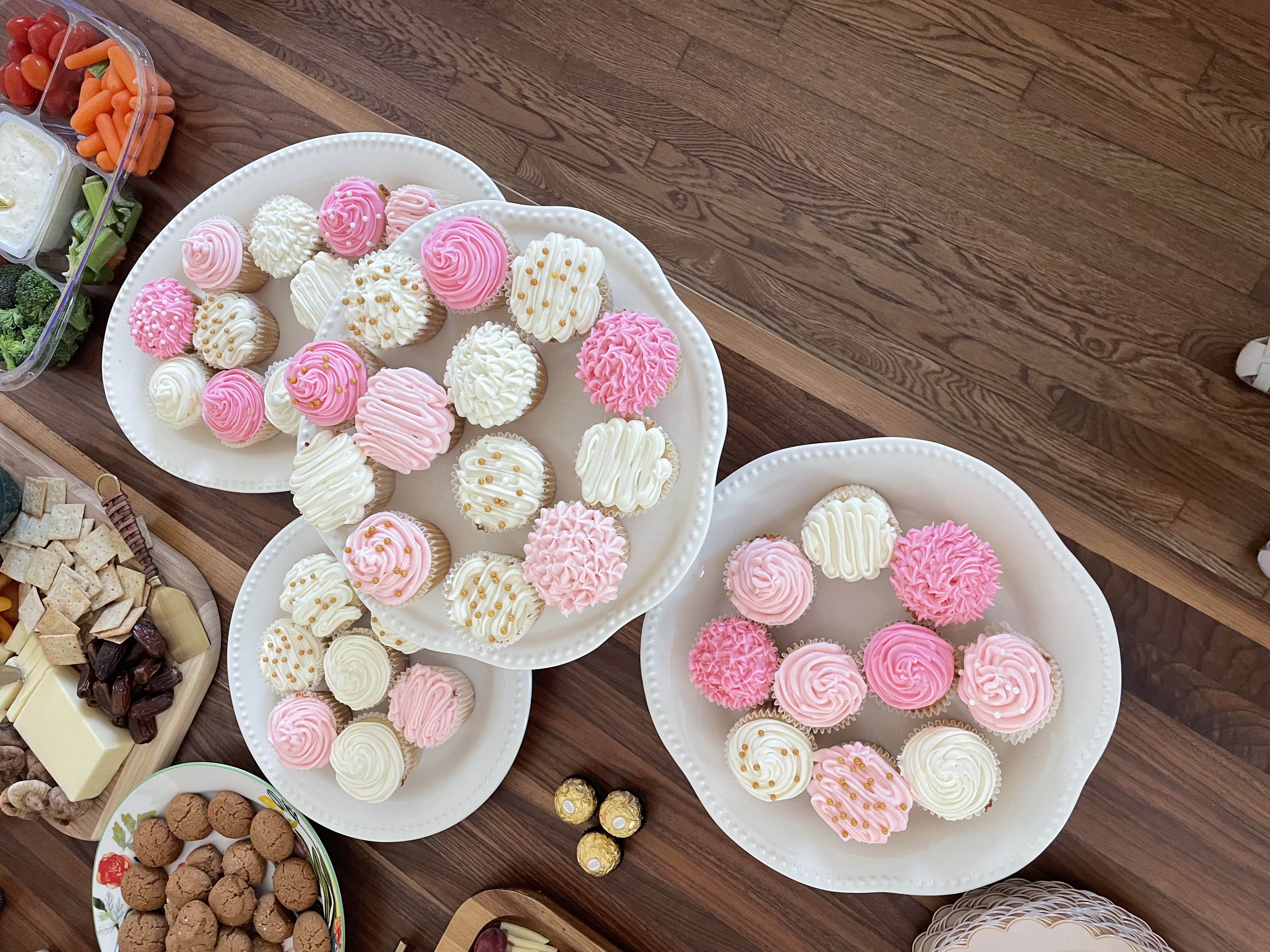 Pink frosted cupcakes on a platter