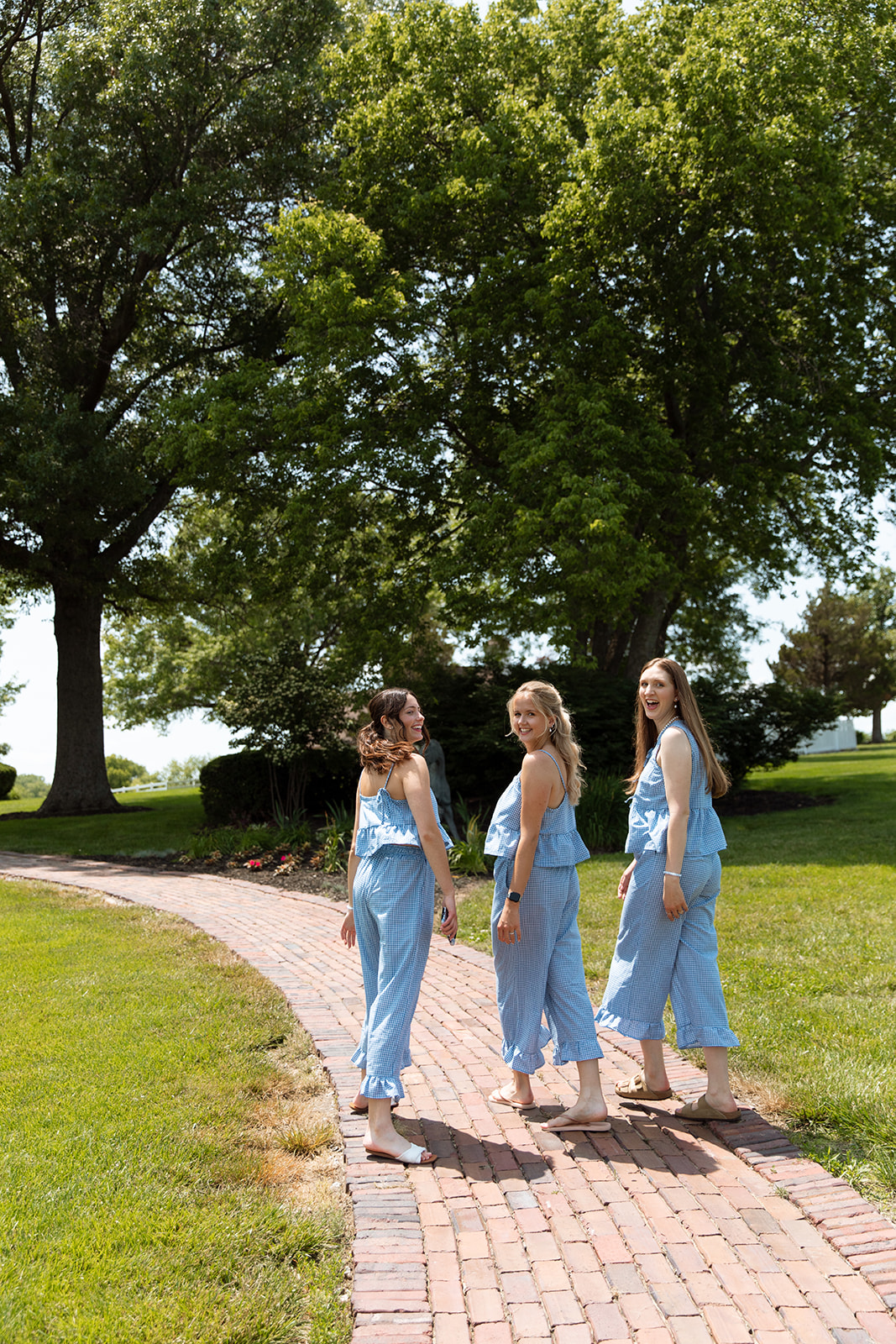 Women in matching blue gingham outfits